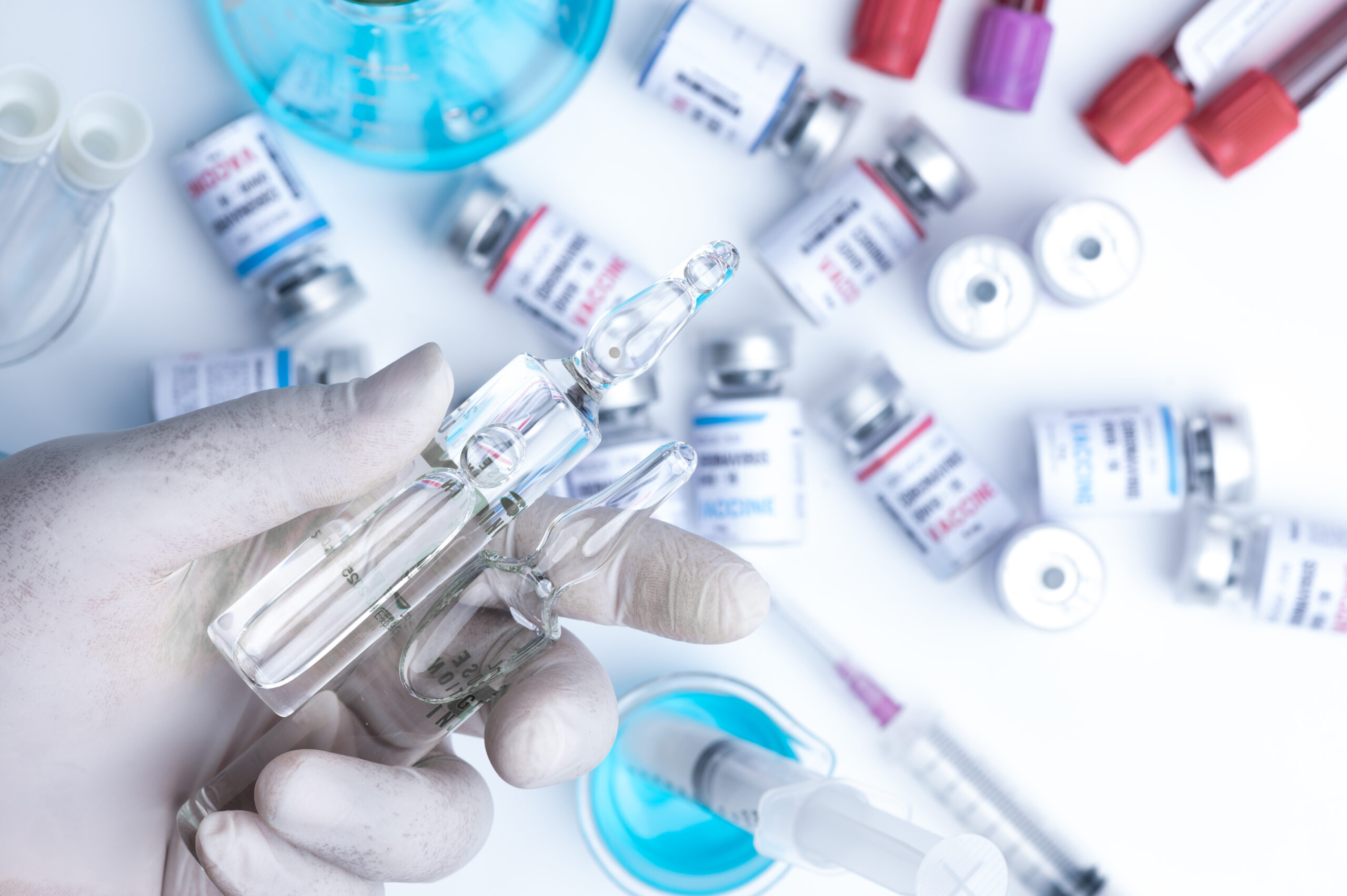 virus vaccine development of a coronavirus COVID-19, vaccine bottle in concept of insurance and fight against coronavirus 2019 ncov cure, medical research in laboratory to stop the spread of the virus