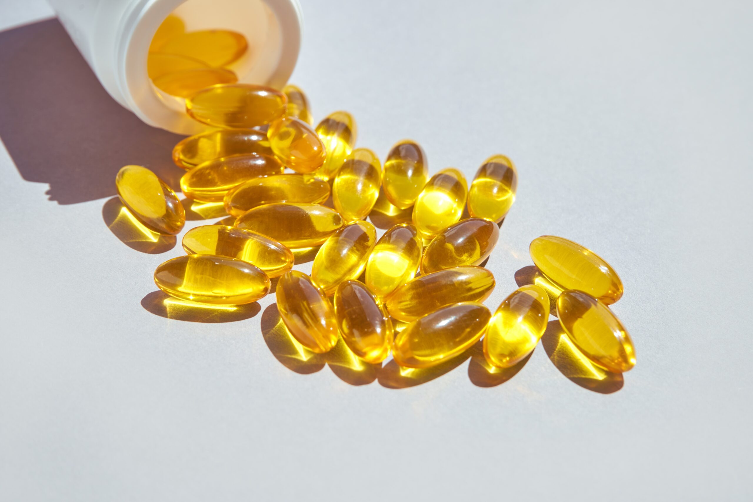 Omega3 gel capsule. Yellow vitamin. Dietology drug. Fish oil supplement