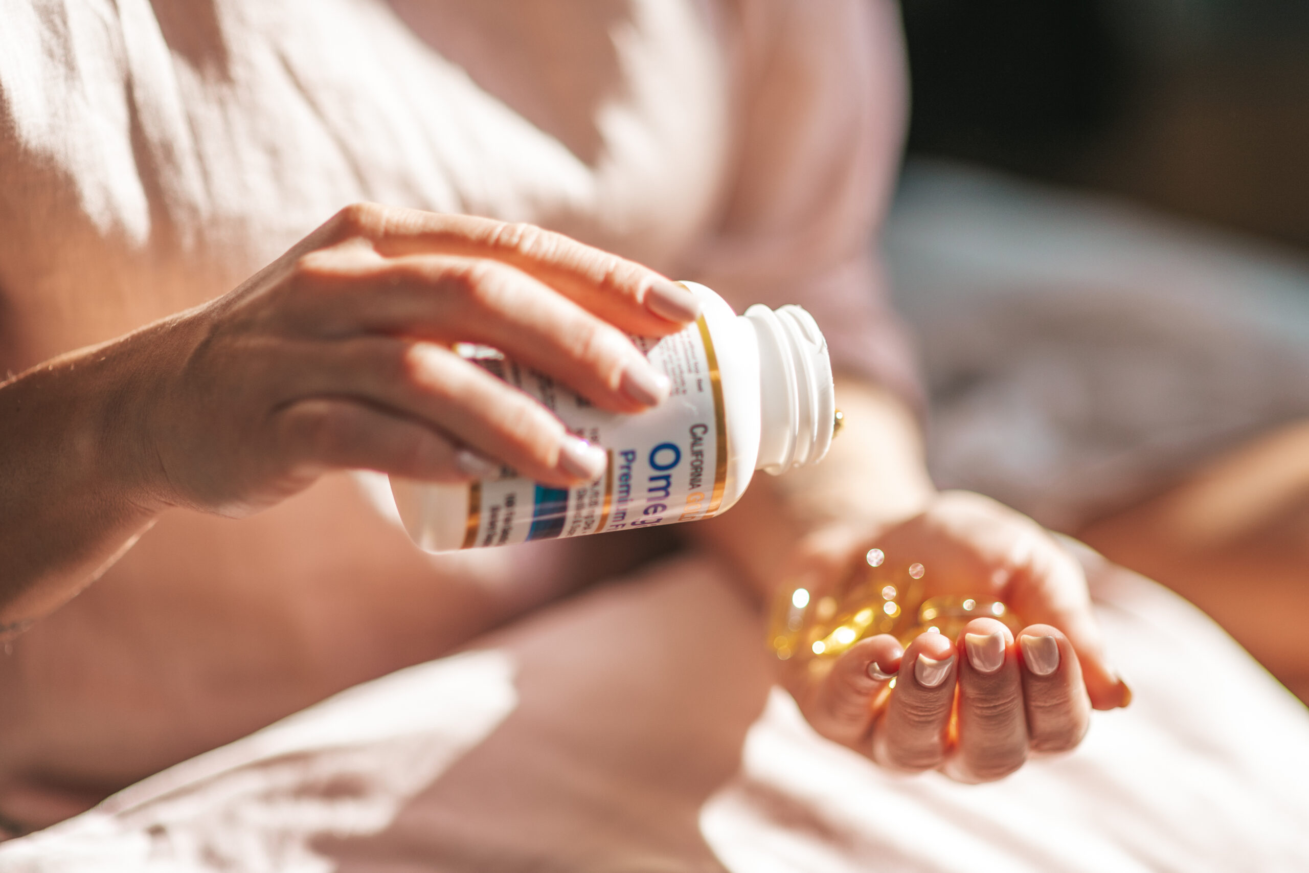 female-hands-hold-vitamin-jelly-capsules-pills-2024-11-03-02-06-11-utc