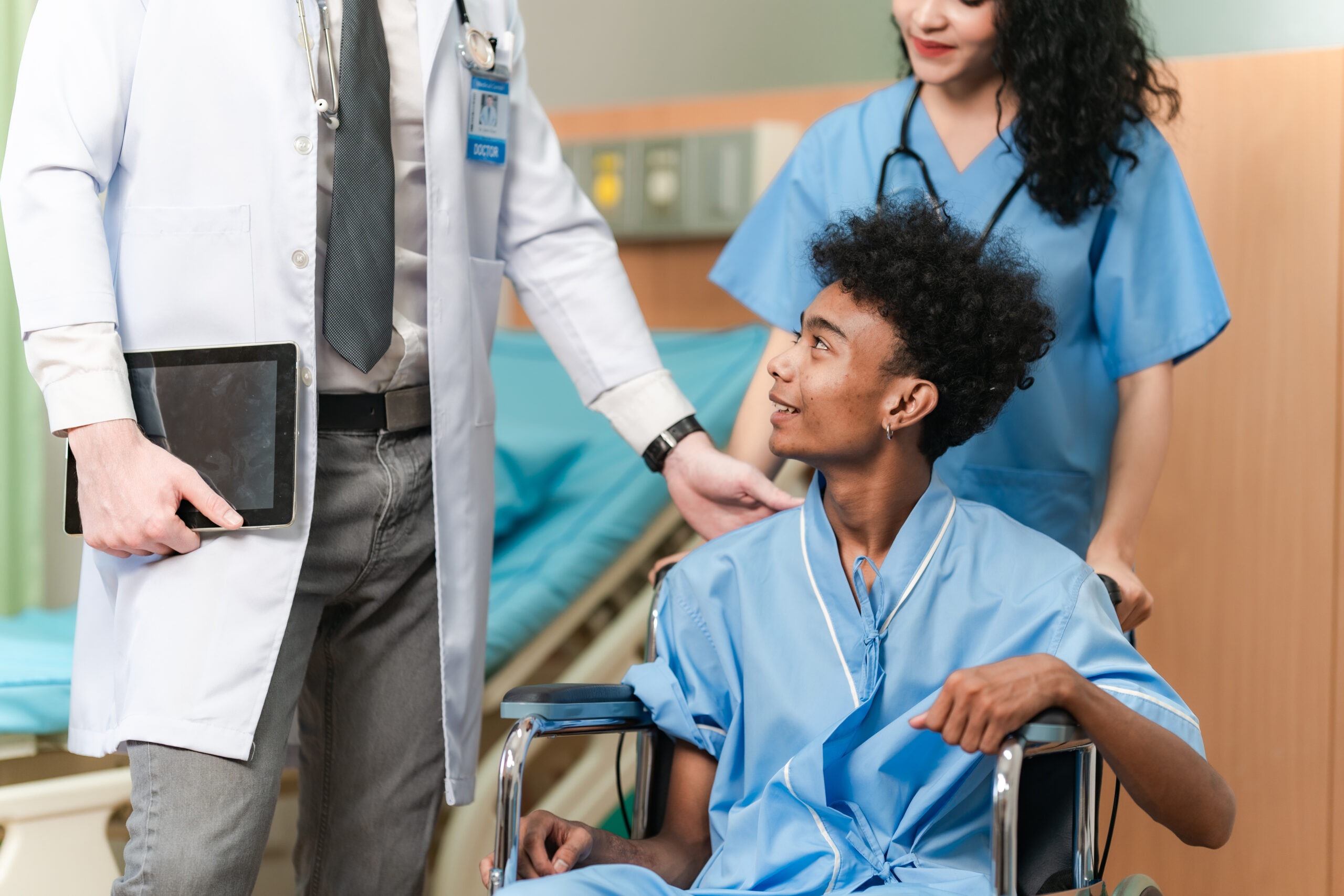 young Asian male doctor and female nurse in lab coat with stethoscope in conversation