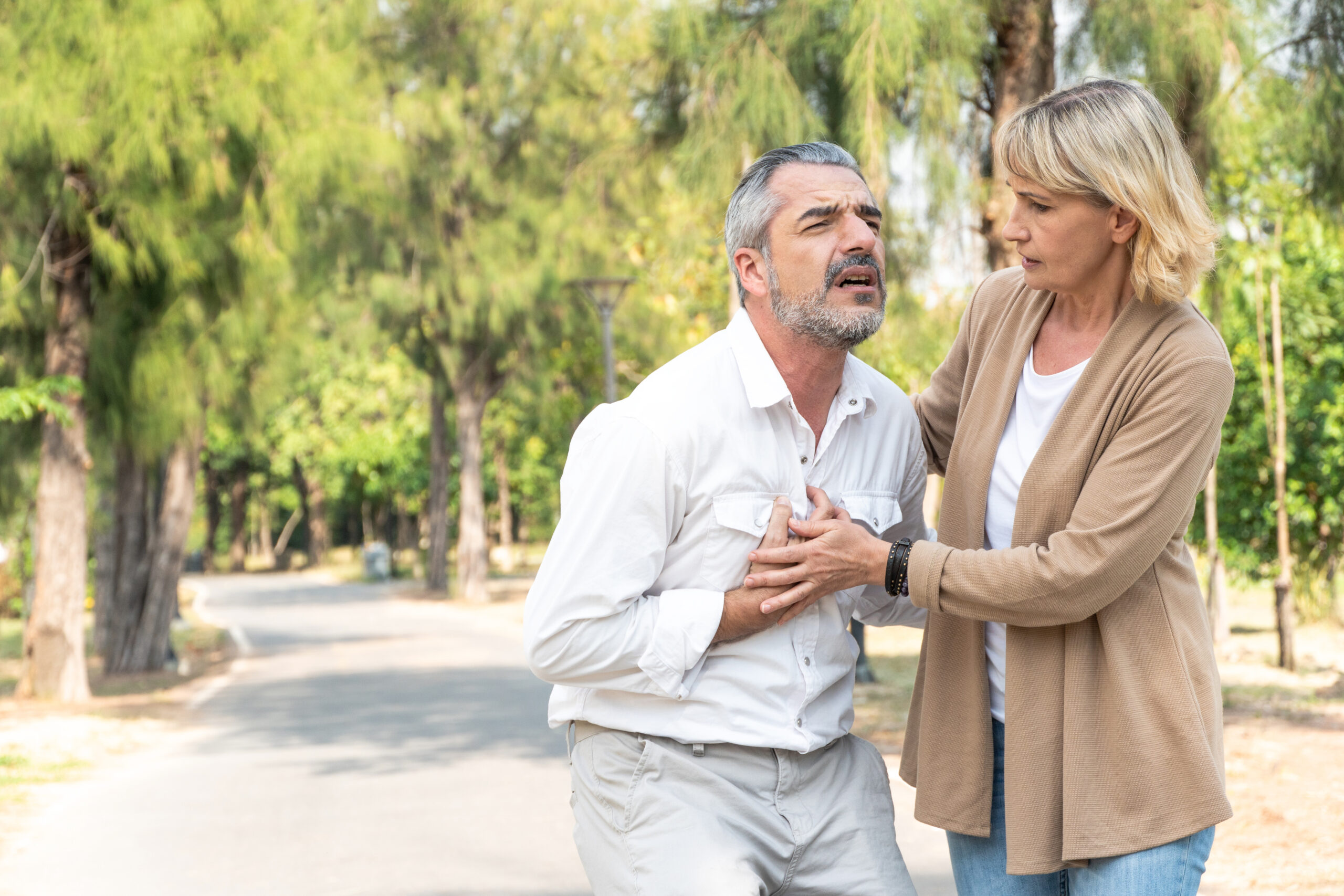 senior man suffering and having chest pain
