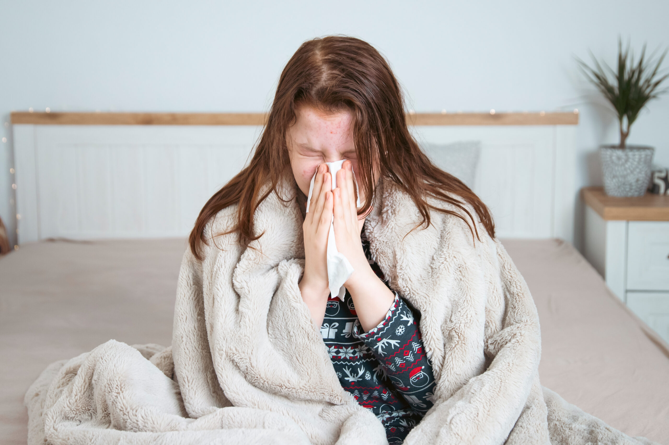 Sick child at home in bed. Acute respiratory viral infection.