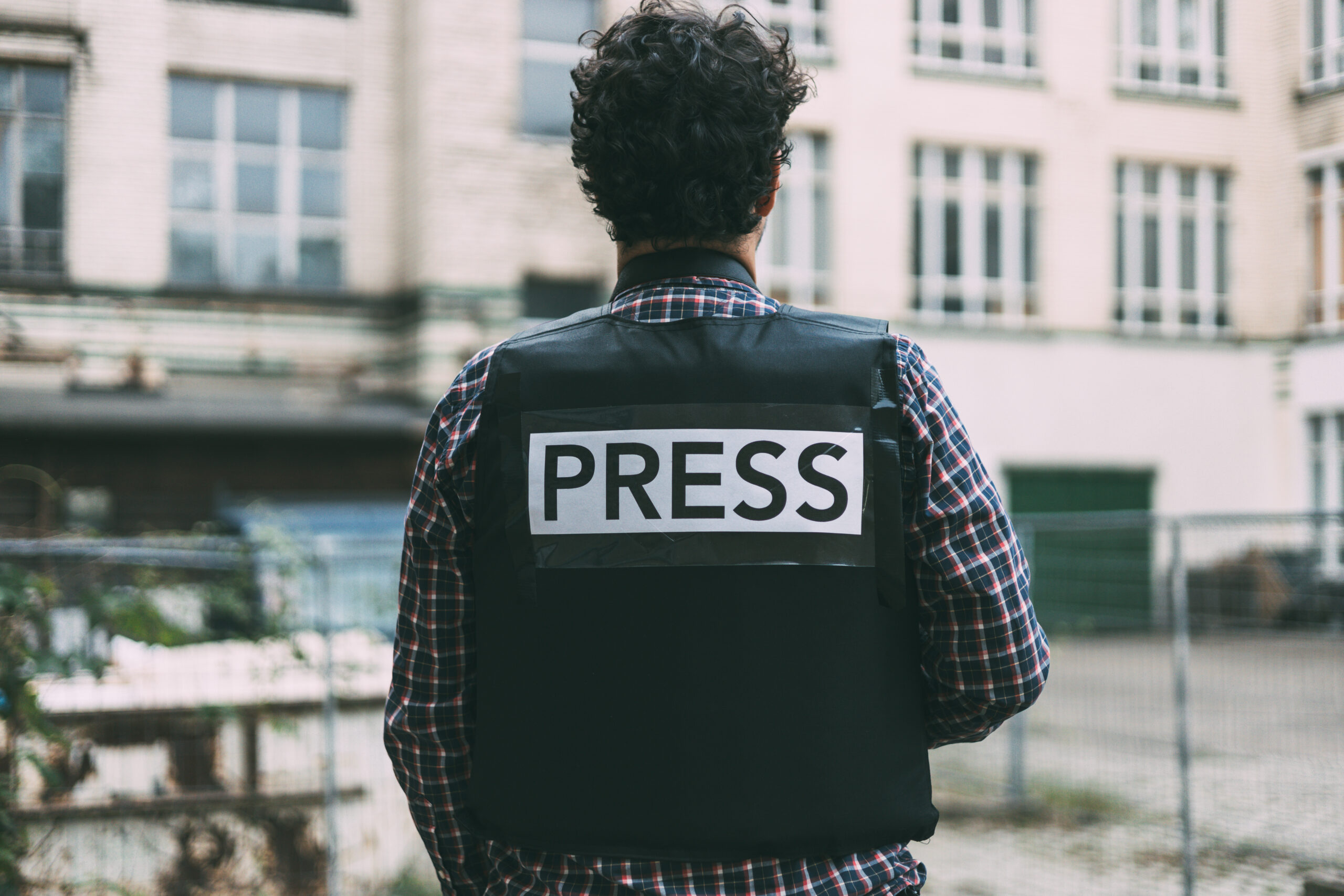 photojournalist-with-bulletproof-vest-on-his-back-2025-01-10-12-47-29-utc