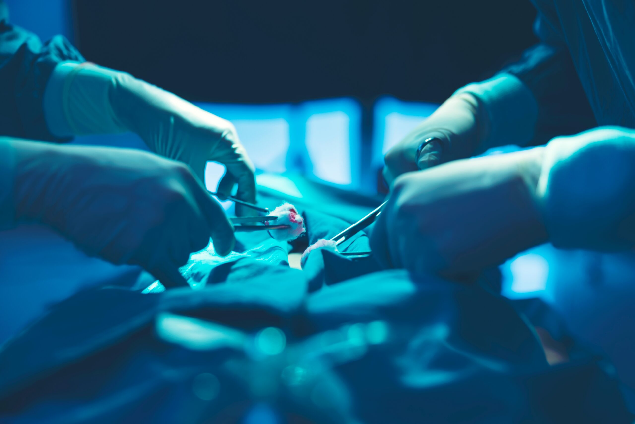 In a operating room, a doctor or medical team is performing a su