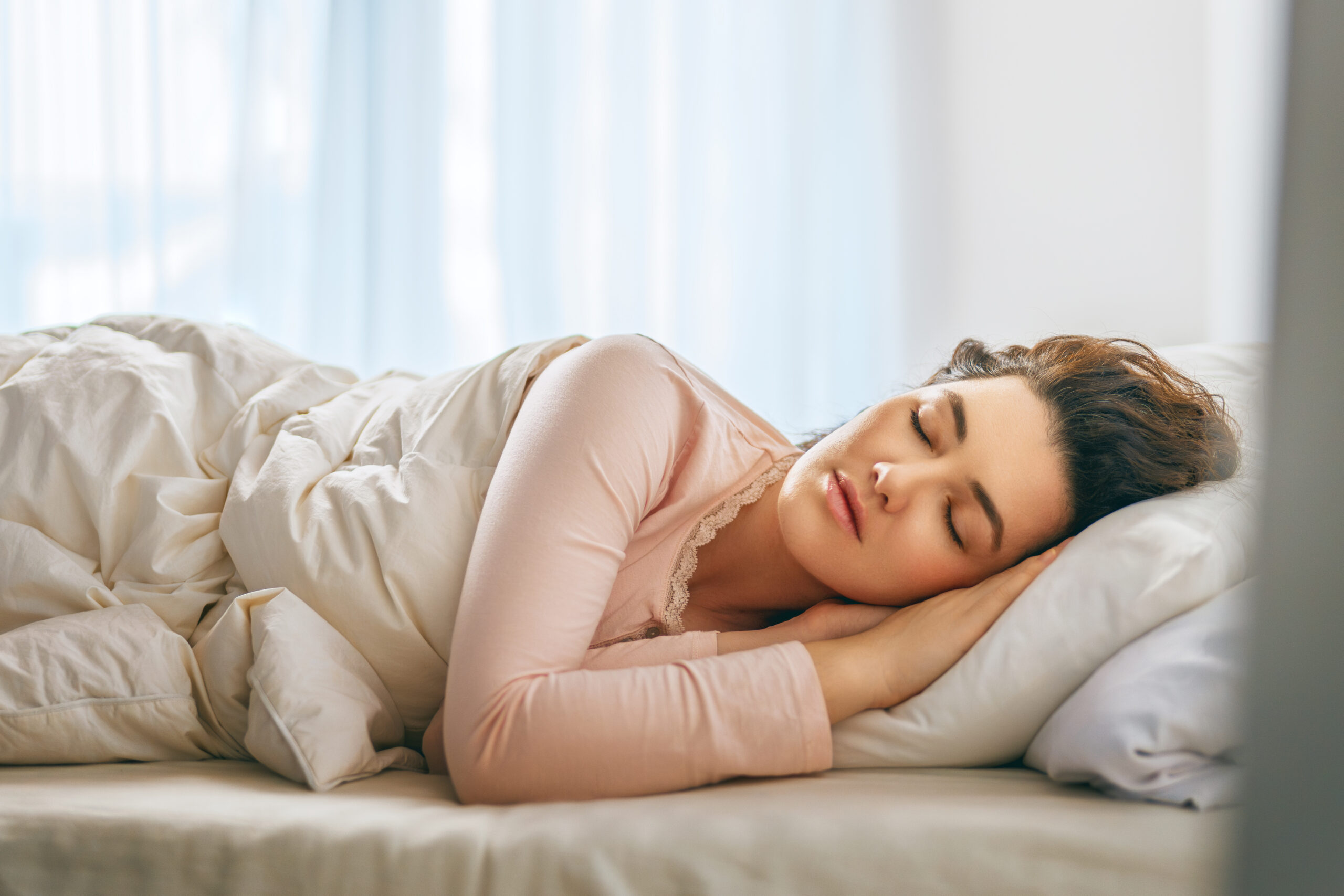 Woman is sleeping in her bedroom